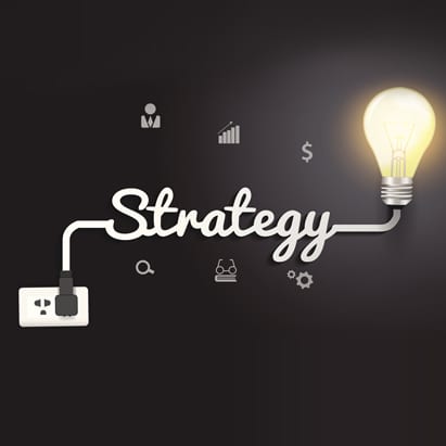 strategic marketing planning shown as cursive writing with a lightbulb